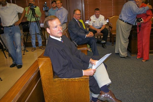 Judge Scott Crichton sits on bench, waiting to swear-in Caddo Sheriff Steve Prator.