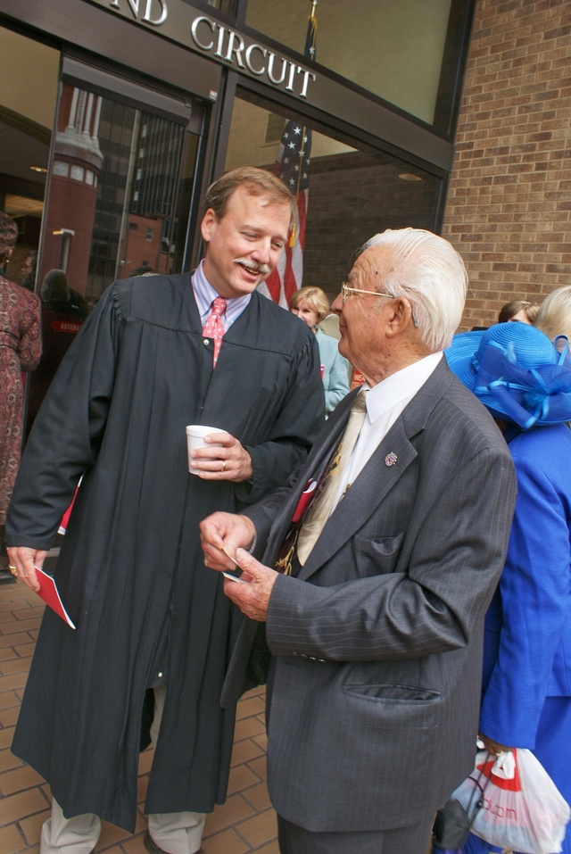 Judge Scott Crichton chats with longtime friend, and Shreveport  political consultant Angelo Ropollo, following the Red Mass on May 1st, 2009.