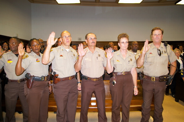 Several Caddo Parish Deputies&nbsp;take their oath of office, administered&nbsp;by Sheriff Steve Prator.