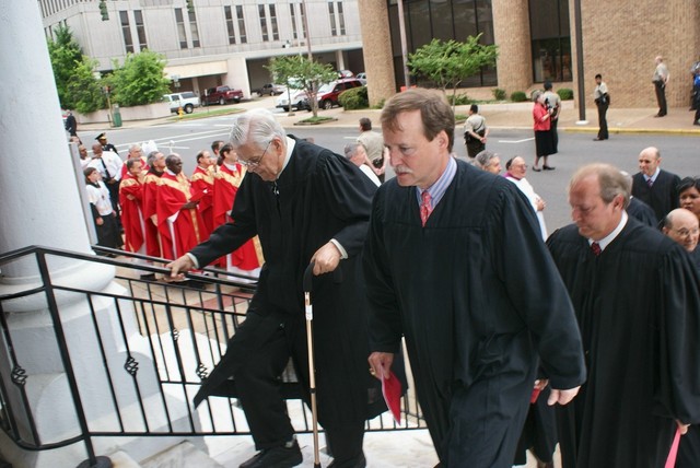 A procession of judges climbed the steps to Holy Trinity Church for the 2009 Red Mass Observance. Entering are Judges James E. Clark, Scott Crichton, John Slattery, Bill Kelly, and Mike Pittman.